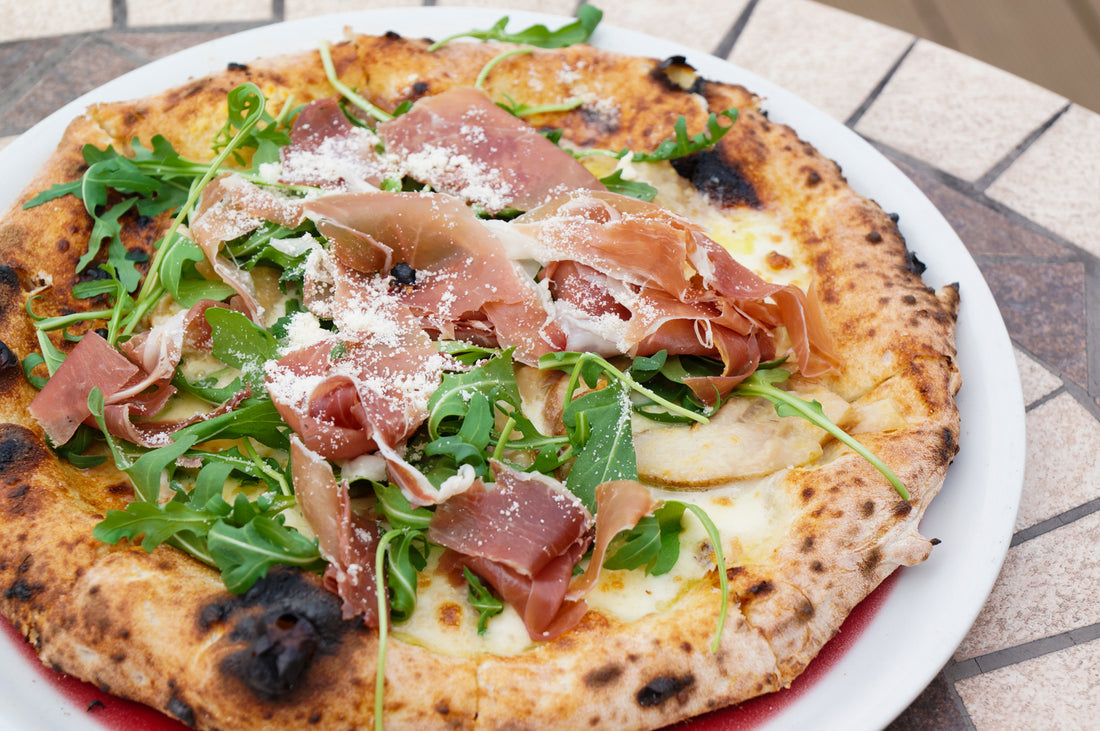 Pizza Bianca with Fior di Latte Cheese, Parma Ham, Rocket Leaves & Freshly Grated Parmesan Cheese