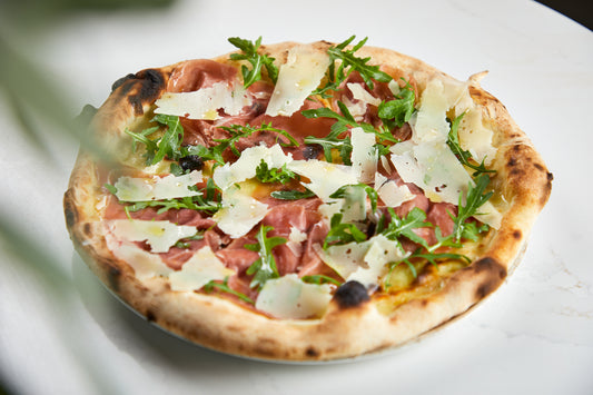 White Pizza with Mozzarella, Speck Ham, Rocket Leaves & Freshly Shaved Parmesan Cheese